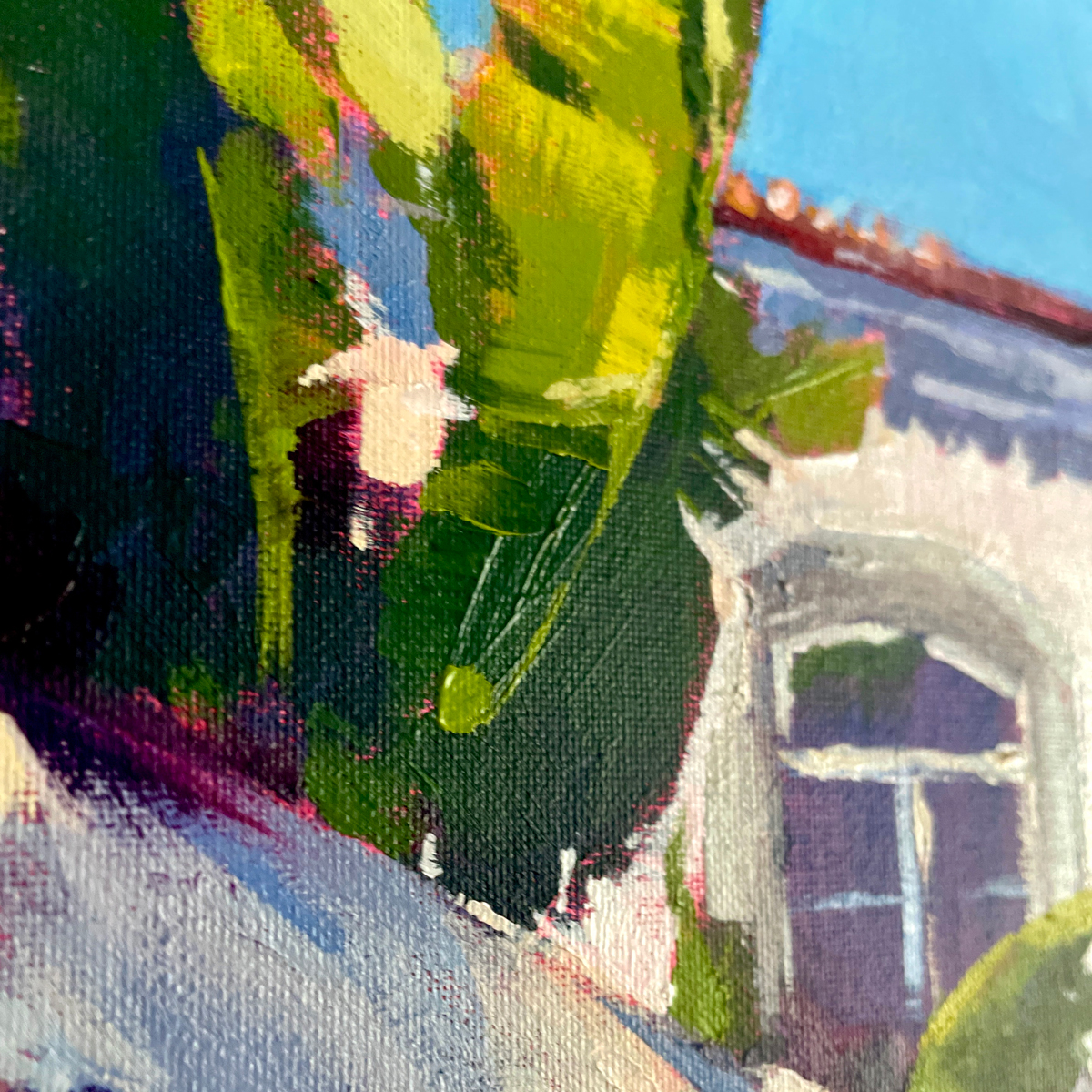 A close-up of an acrylic painting featuring large, vibrant palm leaves inspired by Cidade Velha in Faro, Portugal.